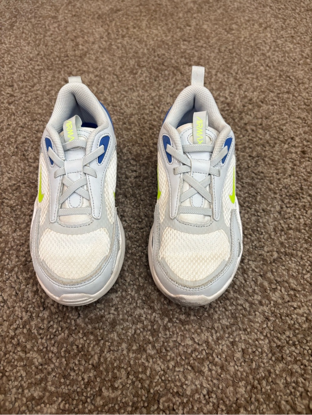 Nike Kids White Sneakers with Blue Accents and Neon Yellow Swoosh